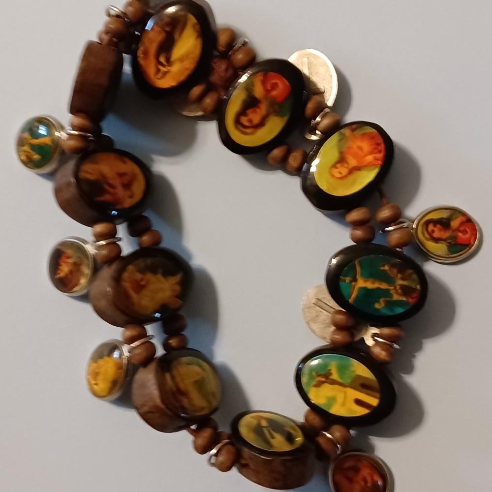 Nice Elastic Bracelet with Religious Images in wood and charms,